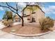 Two-story home featuring a two-car garage, neutral paint and desert landscaping at 23359 W Cocopah St, Buckeye, AZ 85326