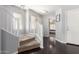 Hallway featuring hardwood floors, a staircase and white interior doors at 23359 W Cocopah St, Buckeye, AZ 85326