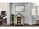 Hallway featuring hardwood floors, gray walls, and a wood console table at 23359 W Cocopah St, Buckeye, AZ 85326