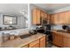 Kitchen counter with view to open living spaces, stainless steel appliances and ample counter space at 23359 W Cocopah St, Buckeye, AZ 85326