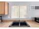Close-up of the kitchen sink area with a window providing natural light at 23359 W Cocopah St, Buckeye, AZ 85326