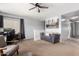 Bright upstairs loft featuring a workstation, comfortable seating, and neutral decor at 23359 W Cocopah St, Buckeye, AZ 85326