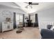 Bright living area featuring desk, seating, vaulted ceilings, and modern decor at 23359 W Cocopah St, Buckeye, AZ 85326