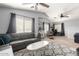 Spacious living area featuring vaulted ceilings, fan, and comfortable seating with a decorative rug at 23359 W Cocopah St, Buckeye, AZ 85326