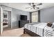 Bedroom with a bed, dresser, window and a view into another room at 23359 W Cocopah St, Buckeye, AZ 85326