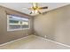 Bedroom featuring window and tile floors at 2348 W Laurel Ln, Phoenix, AZ 85029