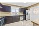 Well-appointed kitchen featuring granite countertops, tile floors and stainless steel appliances at 2348 W Laurel Ln, Phoenix, AZ 85029
