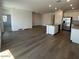 Spacious living room featuring hardwood floors and an open concept design at 25156 W Wayland Dr, Buckeye, AZ 85326