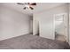 Comfortable bedroom with carpet flooring that leads to the bathroom and closet entrances at 2600 E Springfield Pl # 10, Chandler, AZ 85286