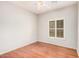 Cozy bedroom features a window and hardwood floors, offering a blend of style and natural light at 2600 E Springfield Pl # 10, Chandler, AZ 85286