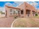 Beautiful home exterior with manicured lawn and inviting covered patio at 2600 E Springfield Pl # 10, Chandler, AZ 85286