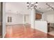 Open-concept living space with hardwood floors flowing into kitchen at 2600 E Springfield Pl # 10, Chandler, AZ 85286