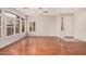 Open-concept living area with hardwood floors, windows, and neutral paint at 2600 E Springfield Pl # 10, Chandler, AZ 85286