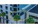 High-rise condo balcony encircled in yellow featuring an outdoor seating area with lush greenery at 3131 N Central Ave # 3001, Phoenix, AZ 85012