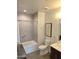 Modern bathroom featuring tile, walk-in shower, soaking tub, updated fixtures, and plenty of natural light at 3131 N Central Ave # 3001, Phoenix, AZ 85012