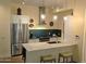 Contemporary kitchen featuring stainless steel appliances, breakfast bar, and stylish pendants at 3131 N Central Ave # 3001, Phoenix, AZ 85012