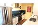 A modern kitchen with stainless steel appliances and blue tiled backsplash at 3131 N Central Ave # 3001, Phoenix, AZ 85012