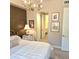 Serene main bedroom with chandelier, and entry to the en-suite bathroom at 3131 N Central Ave # 3001, Phoenix, AZ 85012