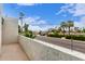 A lovely view from the balcony showing the neighborhood street, homes, palm trees and mountain landscape beyond at 3314 N 68Th St # 247, Scottsdale, AZ 85251