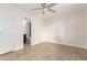 Well-lit bedroom featuring tiled flooring, a ceiling fan and an ensuite bathroom at 3314 N 68Th St # 247, Scottsdale, AZ 85251