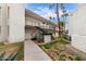 Exterior of the building features stucco, landscaping, walkways, and stairs to the second level at 3314 N 68Th St # 247, Scottsdale, AZ 85251