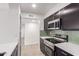 Well-appointed kitchen with stainless steel appliances and dark cabinetry, perfect for modern living at 3314 N 68Th St # 247, Scottsdale, AZ 85251