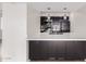 Kitchen with modern appliances, sleek countertops, and stylish dark cabinetry for a contemporary look at 3314 N 68Th St # 247, Scottsdale, AZ 85251