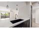 Kitchen sink and countertop with dark cabinetry and stainless steel faucet at 3314 N 68Th St # 247, Scottsdale, AZ 85251