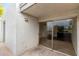 Outdoor patio features a sliding glass door for easy access to the living space, with neutral stucco walls at 3314 N 68Th St # 247, Scottsdale, AZ 85251
