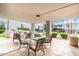 Outdoor patio with dining and barbecue area surrounded by lush greenery and stylish wrought iron furniture at 3314 N 68Th St # 247, Scottsdale, AZ 85251