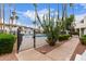 Gated community pool area with desert landscaping and palm trees set against a backdrop of residential buildings at 3314 N 68Th St # 247, Scottsdale, AZ 85251