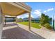 Backyard featuring covered patio, paved area, turf and mural, perfect for relaxation and entertainment at 33290 N Roadrunner Ln, San Tan Valley, AZ 85144