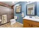 Stylish bathroom featuring wood-look flooring, white marble countertop, and framed shower with sliding door at 33290 N Roadrunner Ln, San Tan Valley, AZ 85144