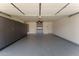 Garage space featuring ample storage with built-in cabinets and epoxy flooring at 33290 N Roadrunner Ln, San Tan Valley, AZ 85144