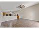 Open floor plan featuring wood tile flooring and views to the kitchen at 33290 N Roadrunner Ln, San Tan Valley, AZ 85144
