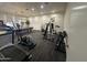 Well-equipped exercise room with weights, treadmills, and ample workout space at 3345 E University Dr # 29, Mesa, AZ 85213