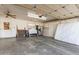 A spacious garage with ample room for parking and storage including a refrigerator and other items at 3345 E University Dr # 29, Mesa, AZ 85213