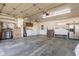 Spacious garage featuring laundry appliances, storage cabinets, and ample room for parking and projects at 3345 E University Dr # 29, Mesa, AZ 85213