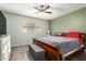 This cozy bedroom boasts a ceiling fan, and a large window at 3345 E University Dr # 29, Mesa, AZ 85213
