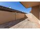 Private patio area with stucco walls, concrete pavers and shaded pergola offers outdoor living space at 3345 E University Dr # 29, Mesa, AZ 85213