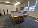 Spacious recreation room with a well-maintained pool table and plenty of natural light at 3345 E University Dr # 29, Mesa, AZ 85213