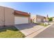 Inviting street view highlighting well-maintained homes with red tile roofs at 3345 E University Dr # 29, Mesa, AZ 85213