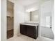 Bathroom featuring a double vanity with granite countertop and a full-size walk-in shower at 35569 N Breezy Ln, San Tan Valley, AZ 85140