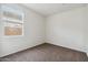 Light-filled bedroom with soft carpet and ample light from the window at 35569 N Breezy Ln, San Tan Valley, AZ 85140