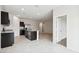 Modern kitchen with granite countertops, dark cabinets, stainless steel appliances, and an open layout at 35569 N Breezy Ln, San Tan Valley, AZ 85140