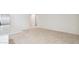 Bright, open-concept living room with neutral tile flooring, perfect for flexible living arrangements at 35569 N Breezy Ln, San Tan Valley, AZ 85140