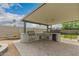 Outdoor kitchen area under covered patio, features stainless steel BBQ and plenty of counter space at 4113 N 10Th Pl, Phoenix, AZ 85014