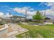 Landscaped backyard with a built in BBQ area, a fire pit with built in seating and mature landscaping at 4113 N 10Th Pl, Phoenix, AZ 85014