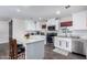 Bright kitchen featuring a center island with granite countertops, stainless steel appliances, and subway tile backsplash at 4113 N 10Th Pl, Phoenix, AZ 85014