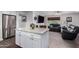 Bright kitchen featuring a center island with granite countertops, stainless steel refrigerator, and open concept living area at 4113 N 10Th Pl, Phoenix, AZ 85014